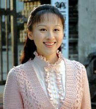 练束梅